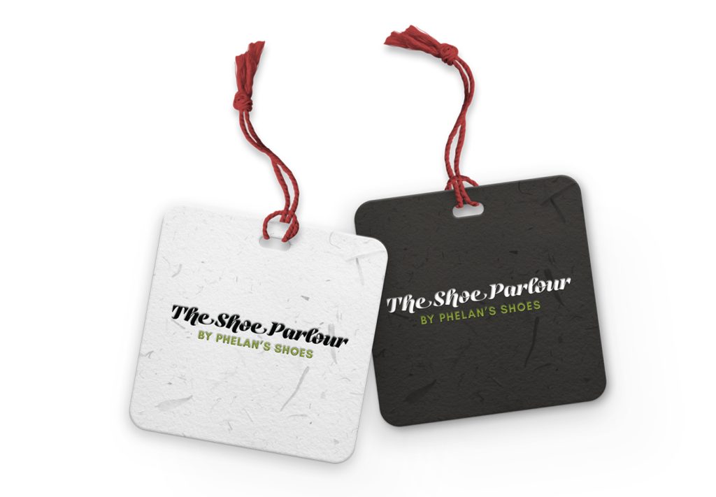 The Shoe Parlour by Phelan's Shoes gift tags in white and black, tied with red string