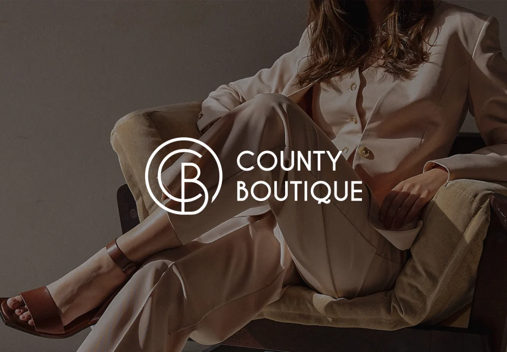 County Boutique logo overlaid on fashion editorial photo